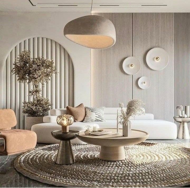 A contemporary living room featuring a sleek sofa, minimalist decor