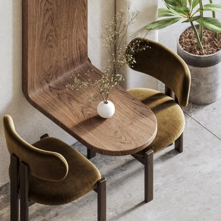 A stylish sitting area with curved chairs and soft neutral tones